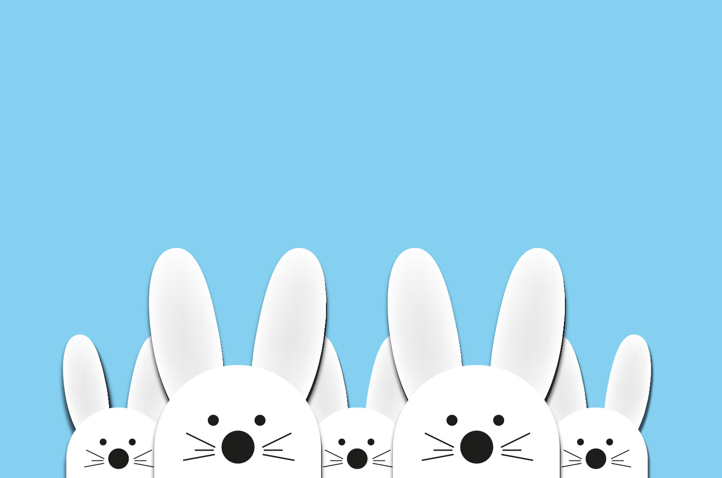 weiße Osterhasenköpfe auf blauem Hintergrund